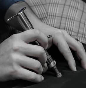 Integrator chiropractic tool being used on patient.