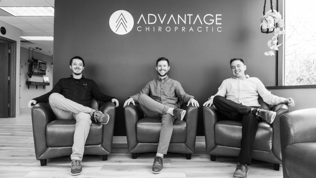 Advantage Chiropractic doctors sitting on a couch at the clinic.