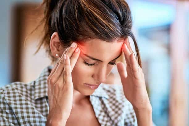 woman in pain from a migraine