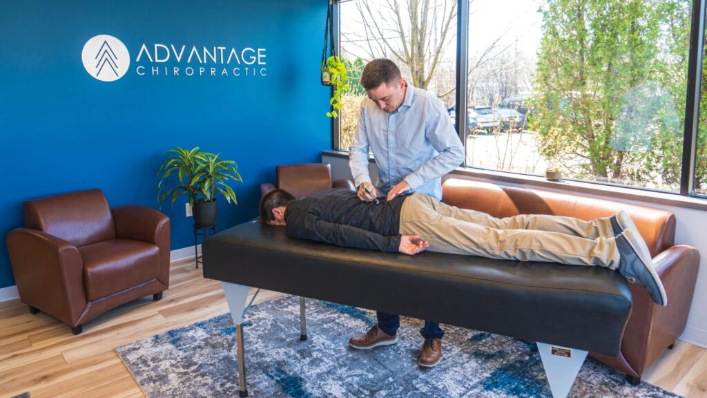 chiropractor adjusting patient with sciatic nerve compression