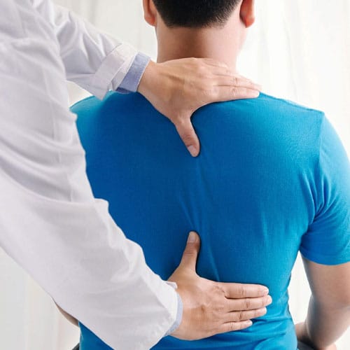 Chiropractic Doctor examining patient from Brookfield, Wi.