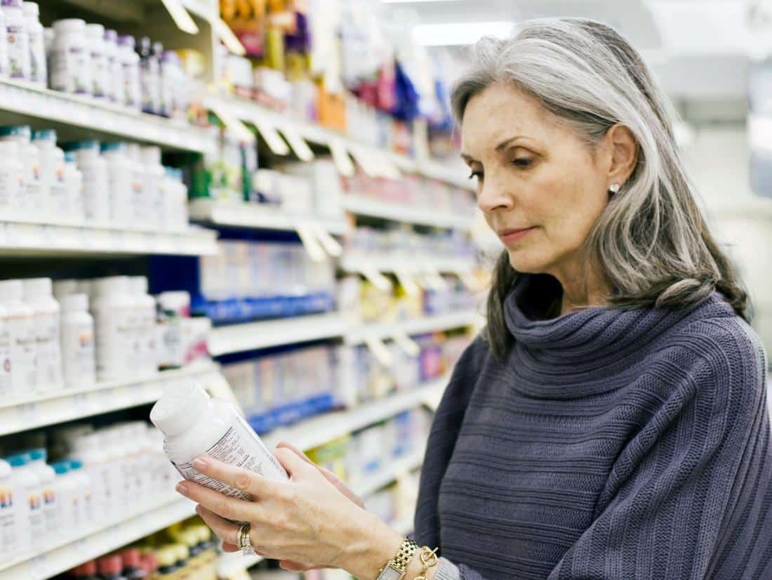 woman looking at supplements for neuropathy.