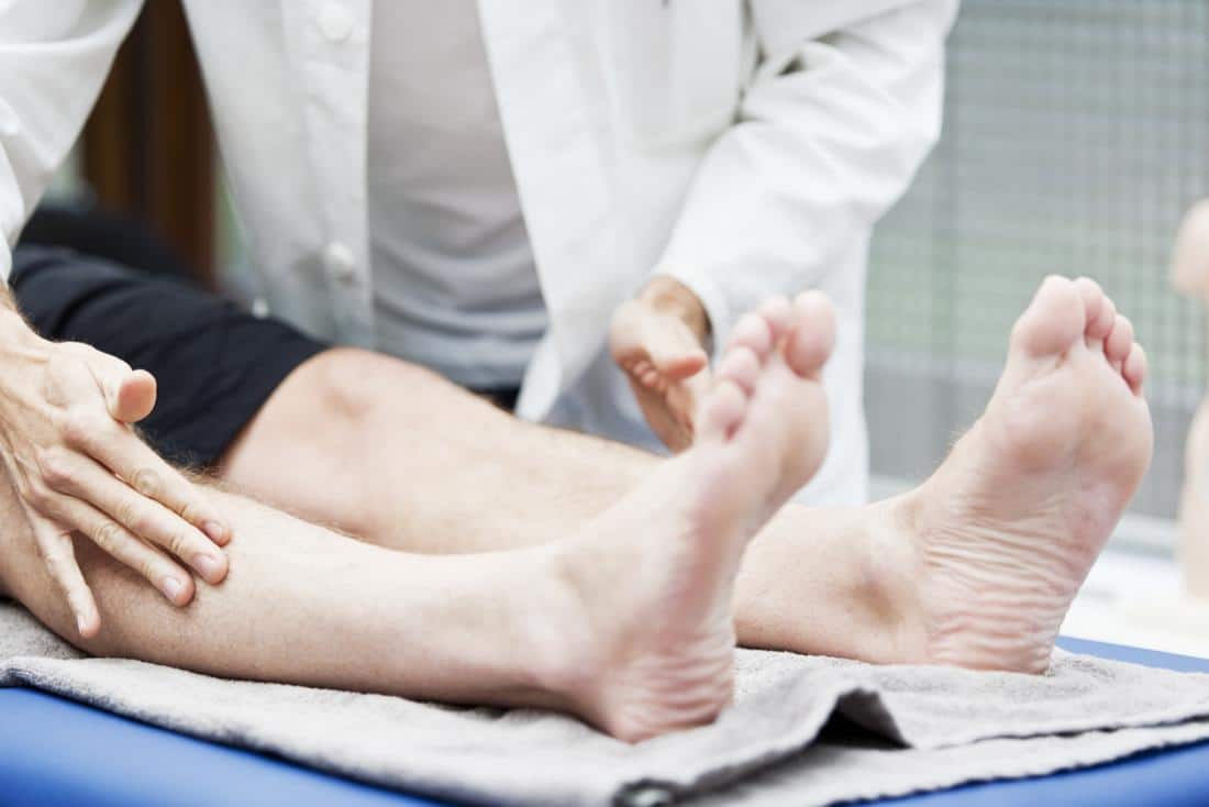 patient with a doctor trying to reverse neuropathy