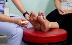 Painful neuropathy in foot doctor is examining.