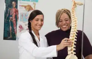 person explaining about are chiropractors doctors to a patient.