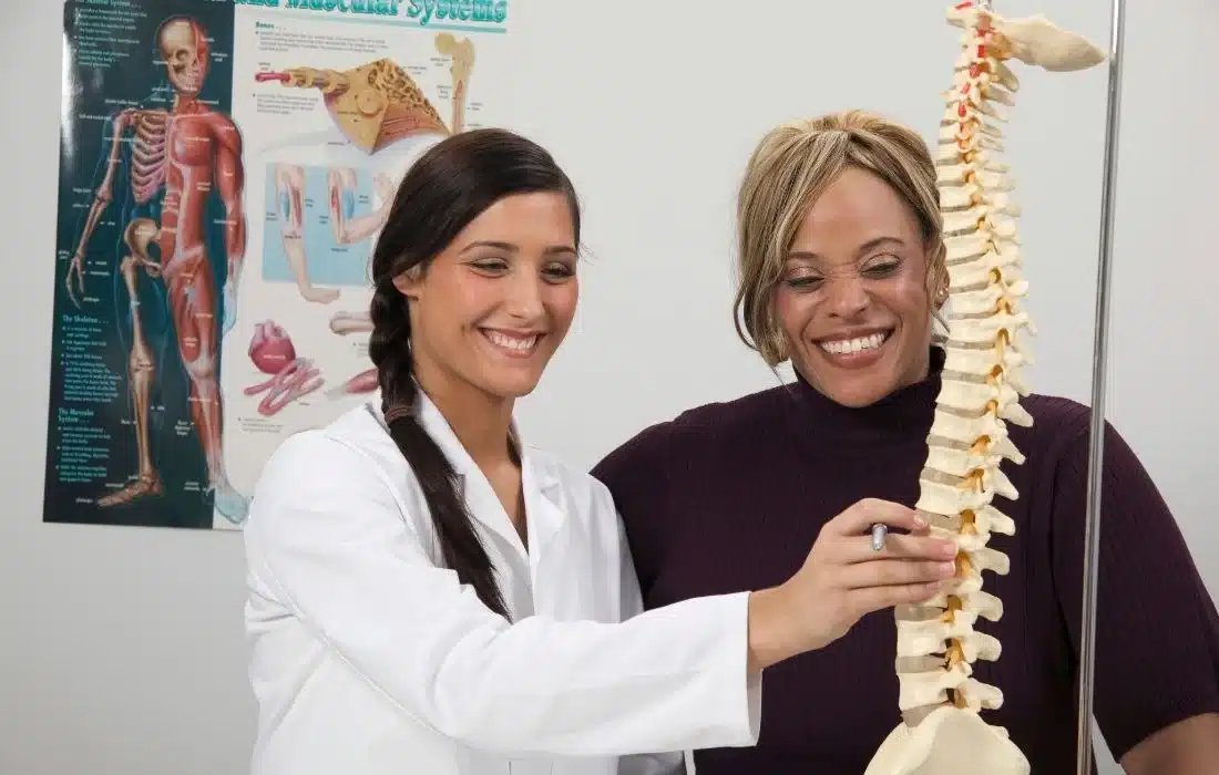 person explaining about are chiropractors doctors to a patient.