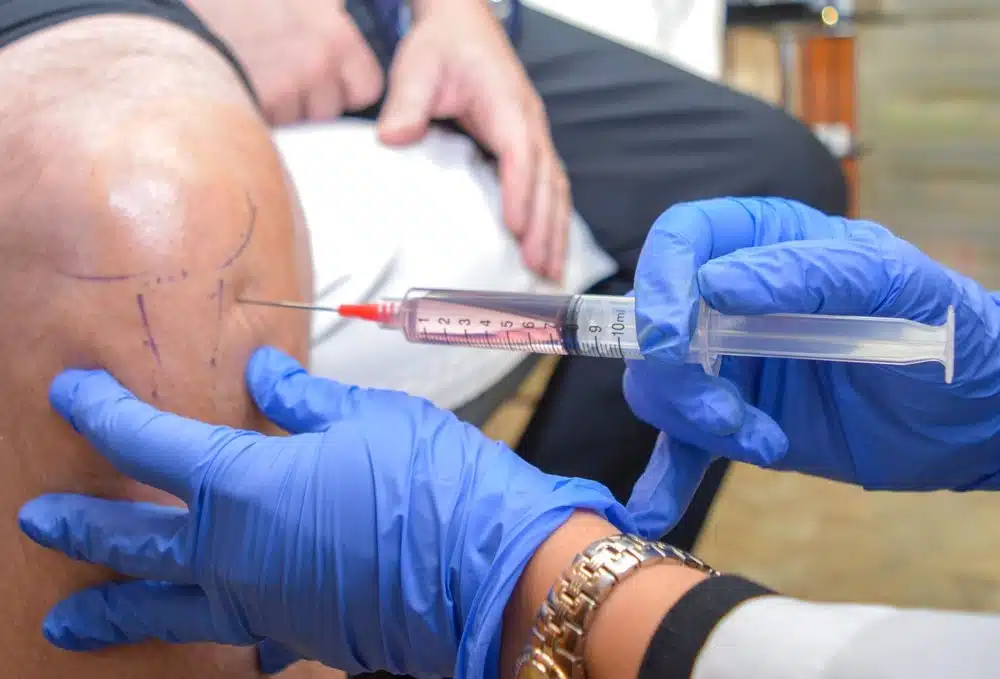 stem cells being injected into patients knee with neuropathy